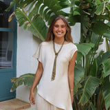 BLUSA SATINADA ASIMETRICA CRUDA